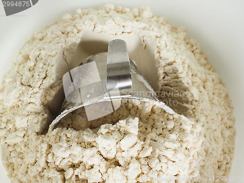 Image of Measurement tool in a bowl of wheat flour