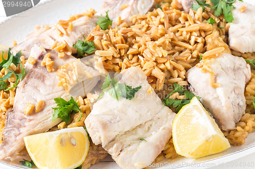 Image of Lebanese fish rice and nuts closeup