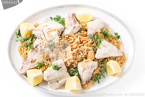 Image of Lebanese fish rice and nuts from above