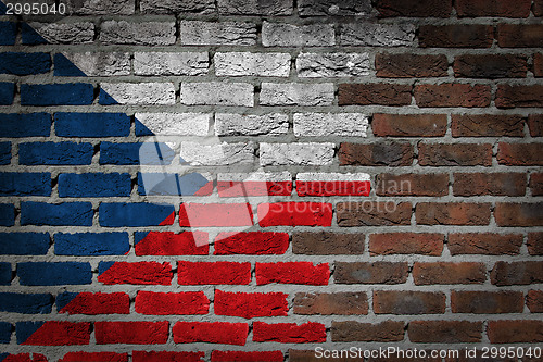 Image of Brick wall texture with flag