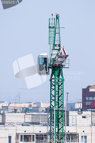 Image of Construction crane over city background