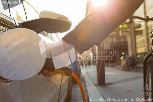 Image of Electric Car in Charging Station.