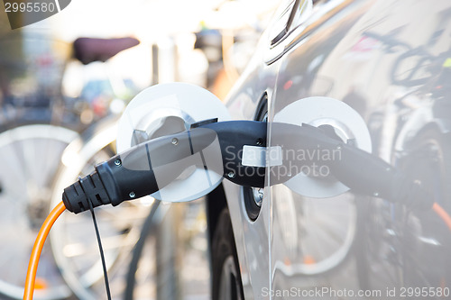 Image of Electric Car in Charging Station.