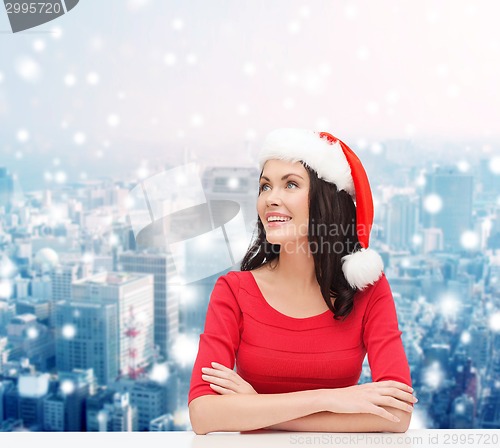 Image of smiling woman in santa helper hat