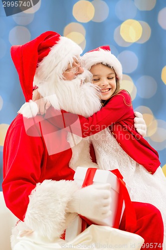 Image of smiling little girl with santa claus