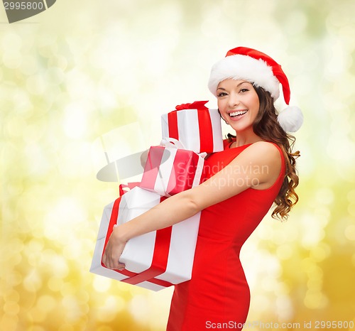 Image of smiling woman in red dress with gift box