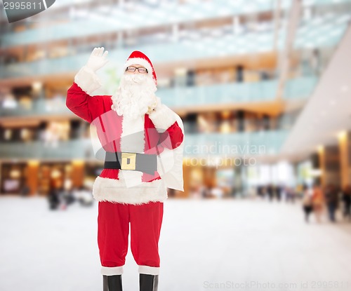 Image of man in costume of santa claus with bag