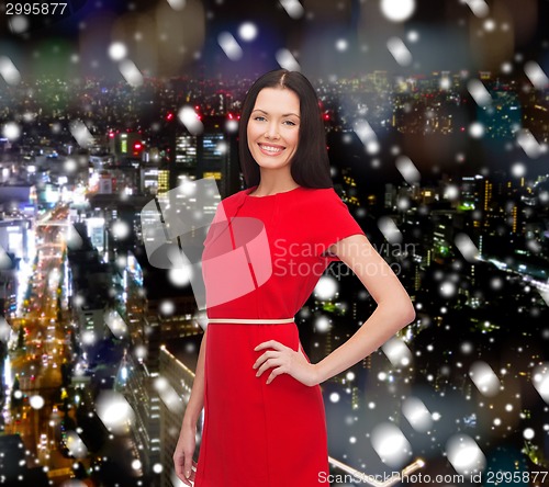 Image of smiling woman in red dress
