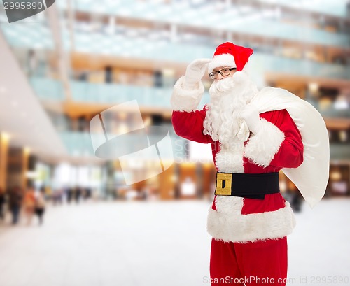 Image of man in costume of santa claus with bag