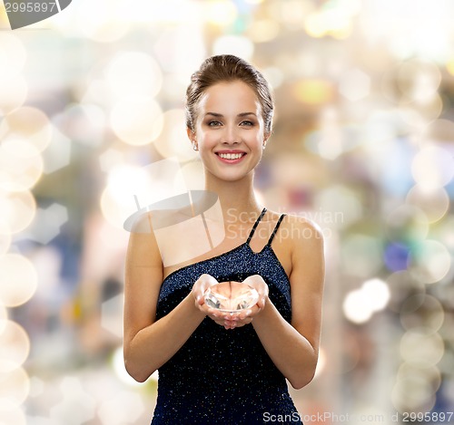 Image of smiling woman in evening dress with diamond