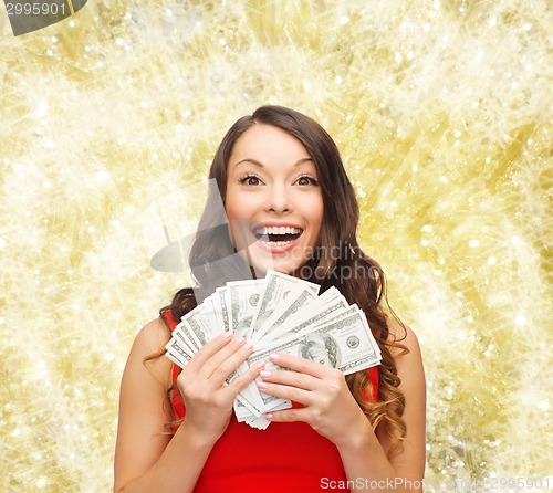 Image of woman in red dress with us dollar money