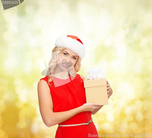 Image of smiling woman in santa helper hat with gift box