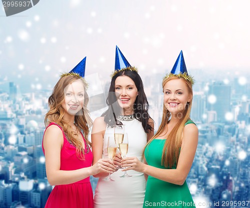 Image of smiling women holding glasses of sparkling wine