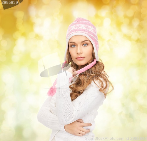 Image of smiling young woman in winter clothes