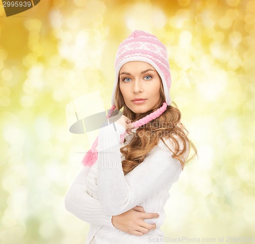 Image of smiling young woman in winter clothes