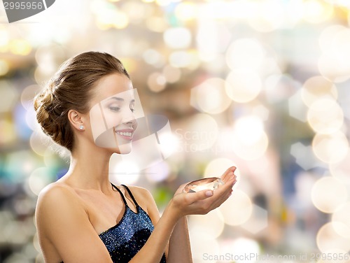 Image of smiling woman in evening dress with diamond