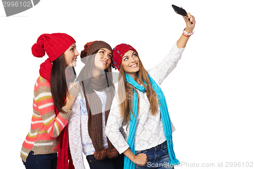 Image of Three women making selfie