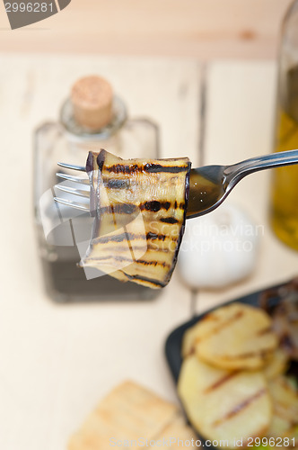 Image of grilled eggplant oubergine on a fork