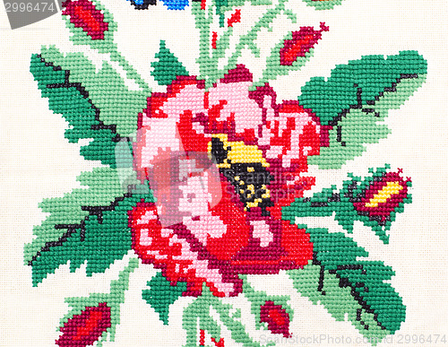 Image of embroidered good by cross-stitch pattern