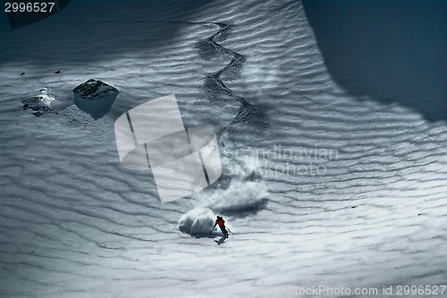 Image of Male skier riding down the hill