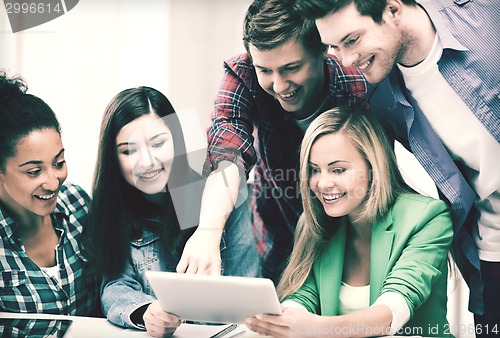 Image of students looking at tablet pc in lecture at school