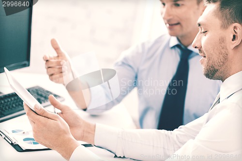 Image of businessmen with notebook and tablet pc