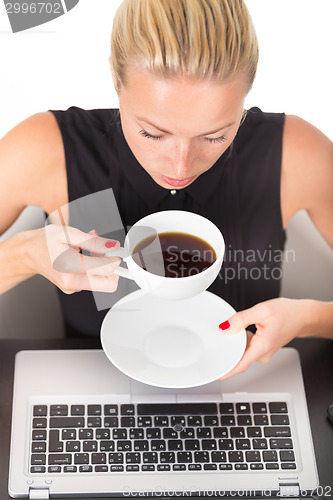 Image of Business woman with cup of coffee.