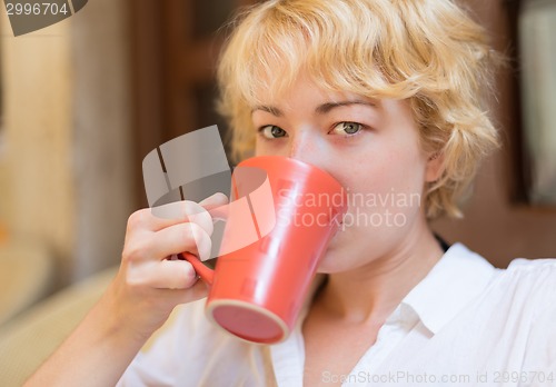 Image of Lady With Cup of Coffee.