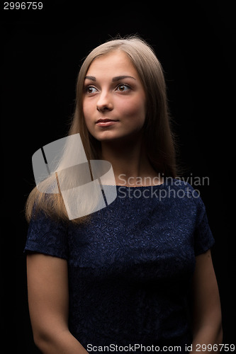 Image of Portrait of a beautiful girl on a black background