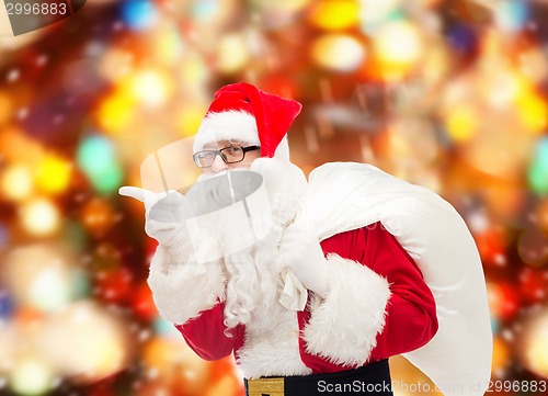 Image of man in costume of santa claus with bag