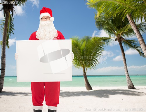 Image of man in costume of santa claus with billboard