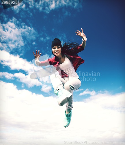 Image of beautiful dancing girl jumping
