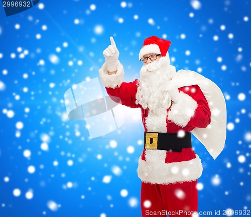 Image of man in costume of santa claus with bag