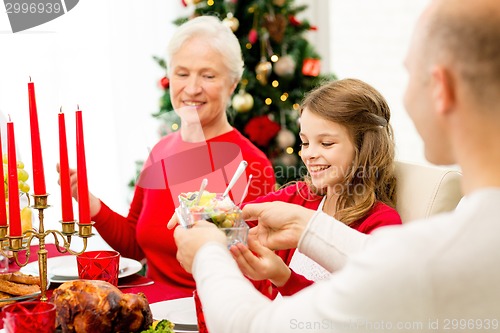 Image of smiling family having holiday dinner at home