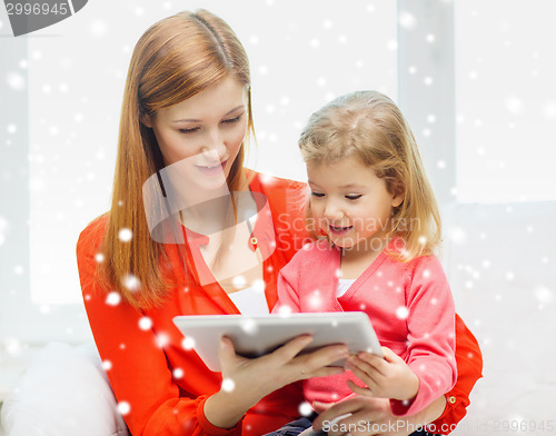 Image of happy mother and daughter with tablet pc computer