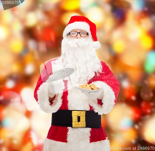 Image of santa claus with glass of milk and cookies