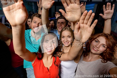 Image of smiling women dancing in club