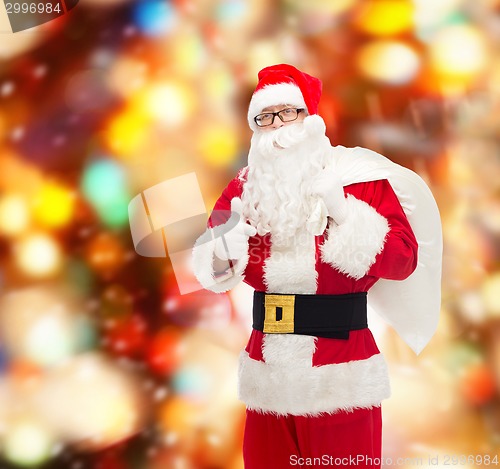 Image of man in costume of santa claus with bag