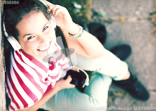 Image of girl with headphones listening to music