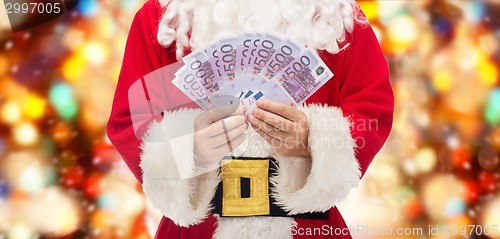 Image of close up of santa claus with euro money