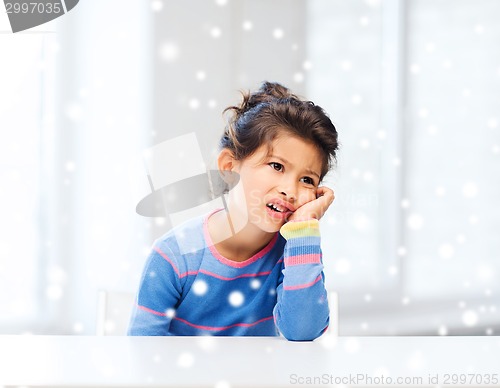 Image of sad or tired little girl indoors