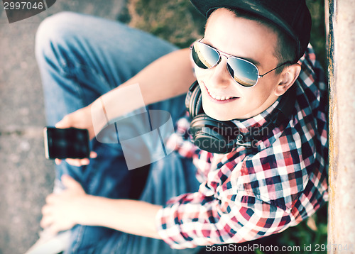 Image of girl with headphones and smartphone