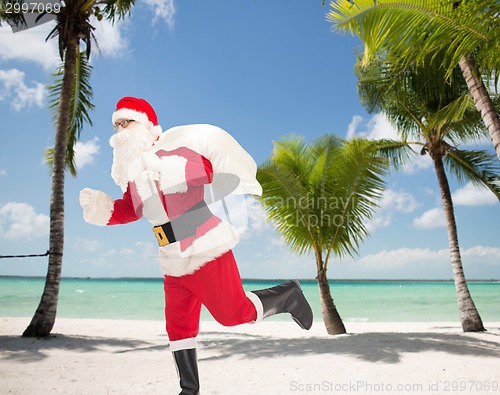 Image of man in costume of santa claus with bag