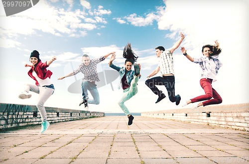 Image of group of teenagers jumping