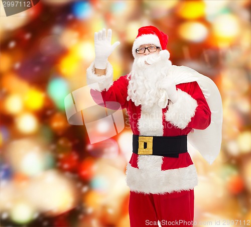 Image of man in costume of santa claus with bag