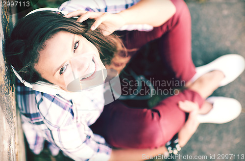 Image of girl with headphones listening to music