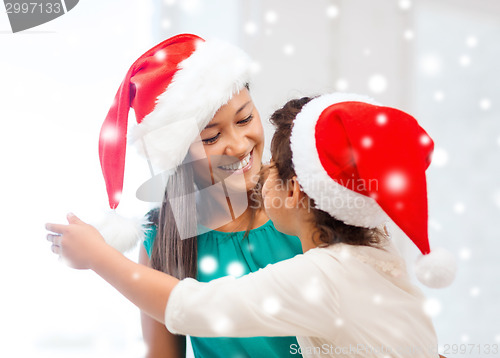 Image of happy mother and child girl with gift box