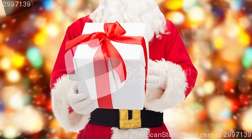 Image of man in costume of santa claus with gift box