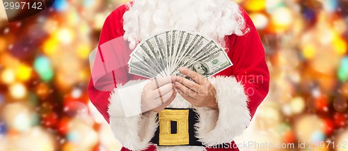 Image of close up of santa claus with dollar money