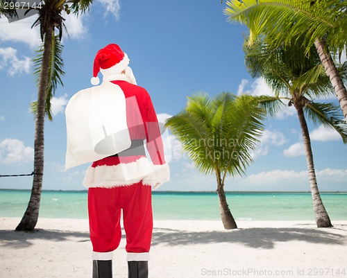 Image of man in costume of santa claus with bag